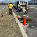 image of storm drain workers and truck during storm drain stabilization