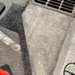 image of patched asphalt after storm drain stabilization