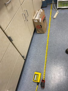 image of measurements being taken before concrete floor slab lifting project