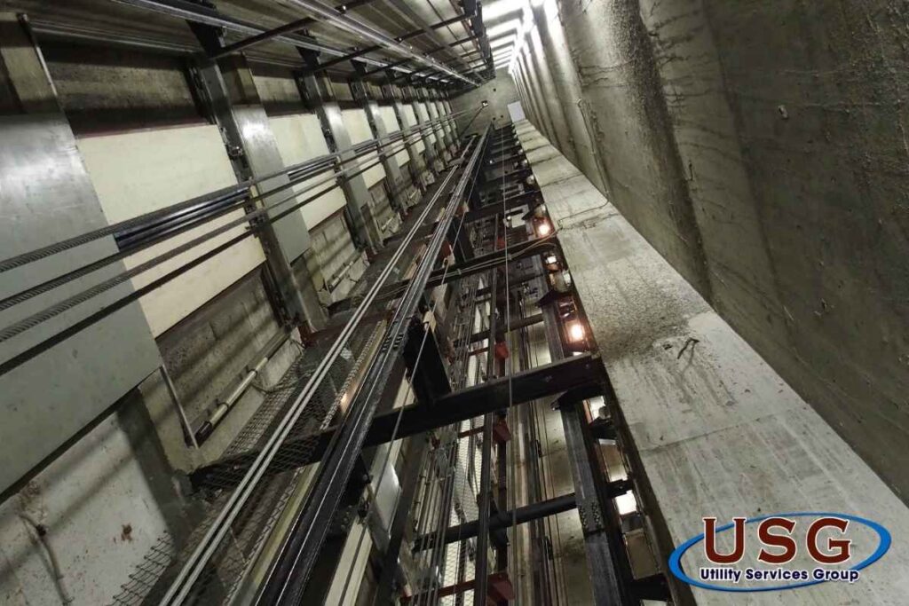 image of elevator pit with USG logo. This is an article cover image for Elevator Pit Sealing to Stop Water Intrusion