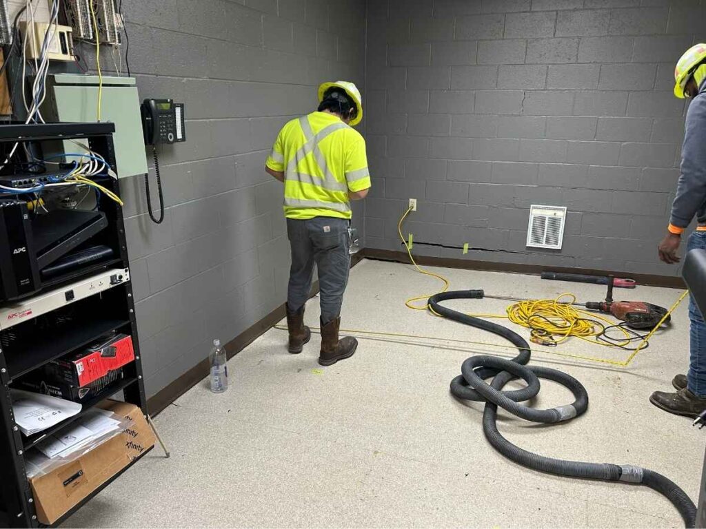 image of USG employee during firehouse utility locate and floor lifting