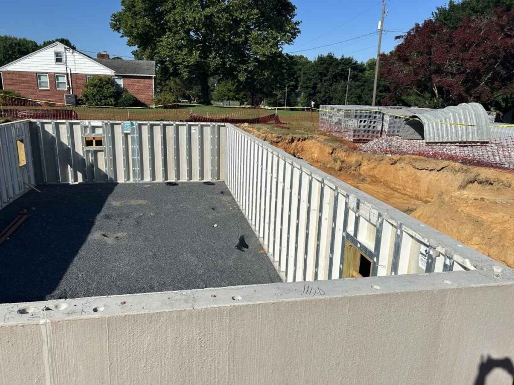 image of new construction walls experiencing sinkholes before soil stabilization from USG